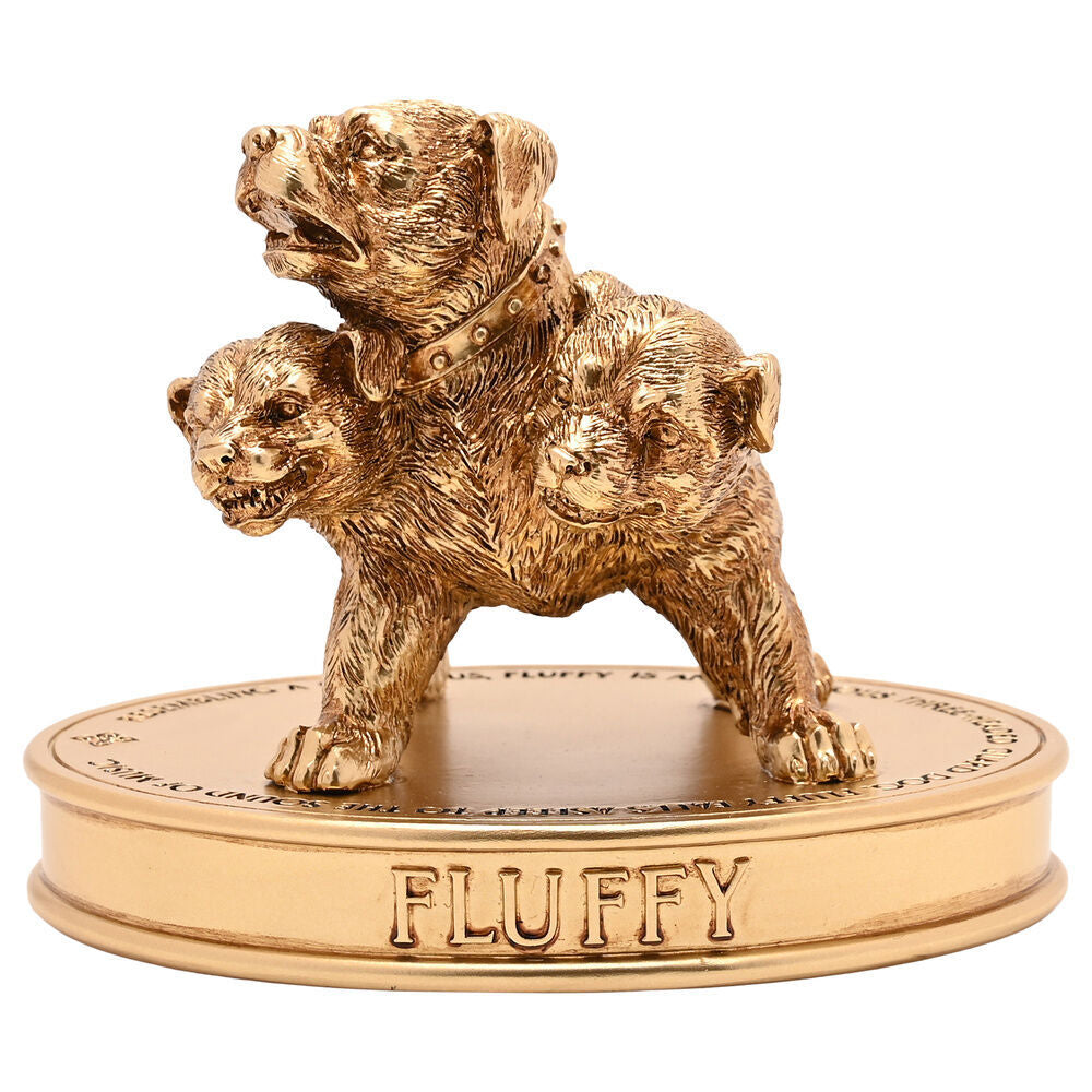 Figurine Touffu dorée Harry Potter représentant le célèbre chien à trois têtes sur un socle gravé.