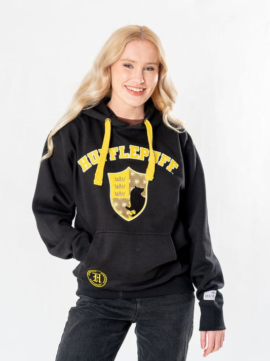 Sweat à capuche mixte Poufsouffle Harry Potter noir avec blason Hufflepuff jaune et cordons jaunes.